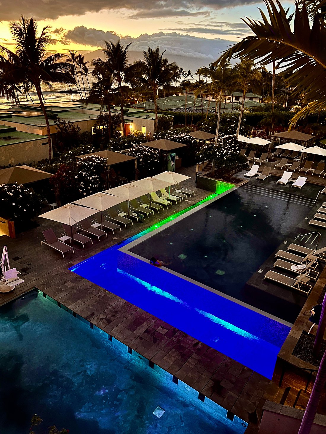 Cascading pools at Andaz Maui after sunset